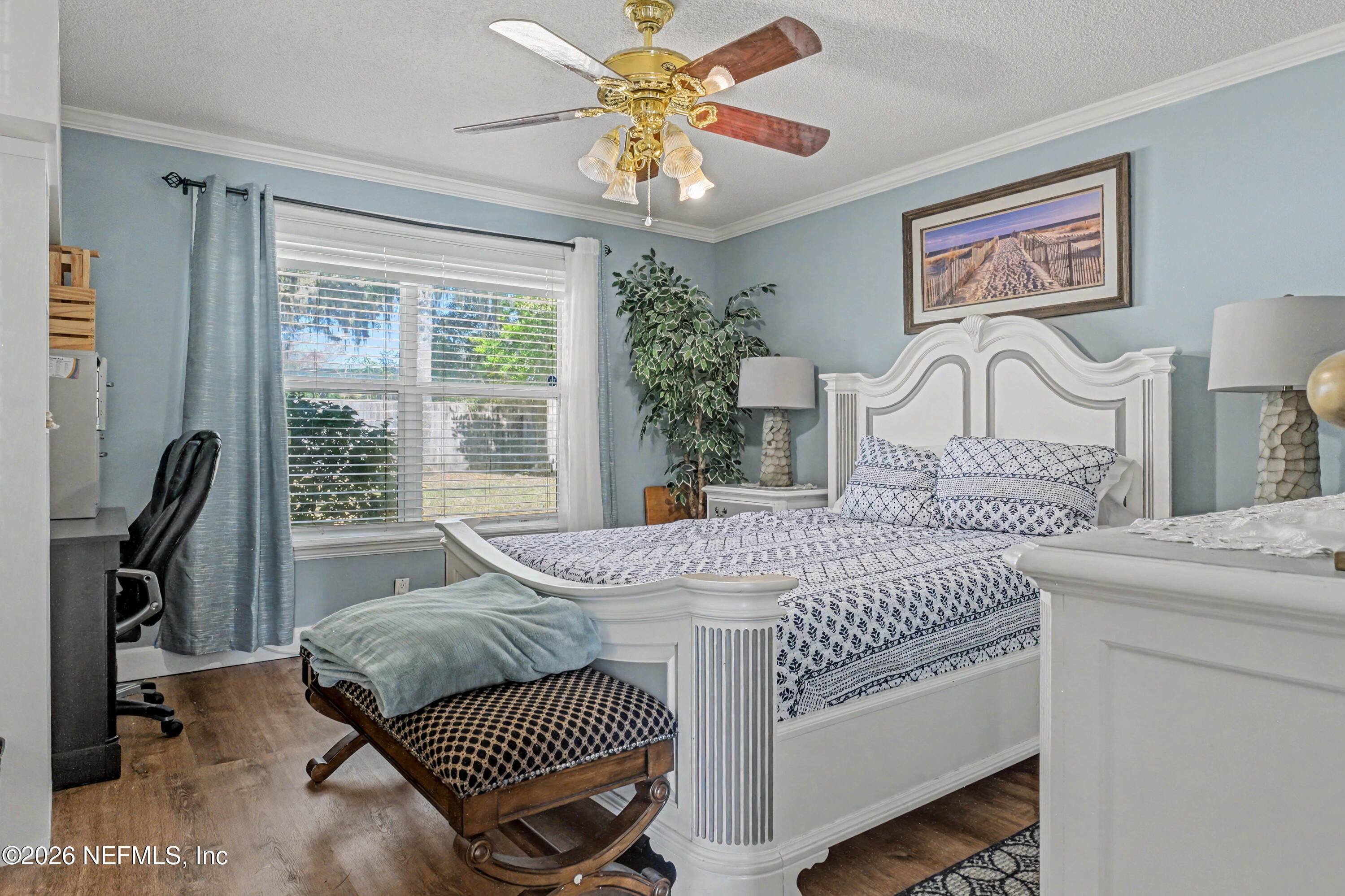 1502 Pointer Drive West Jacksonville, FL 32221 - Photo 22 of 33 a bedroom with a bed and a table with chair