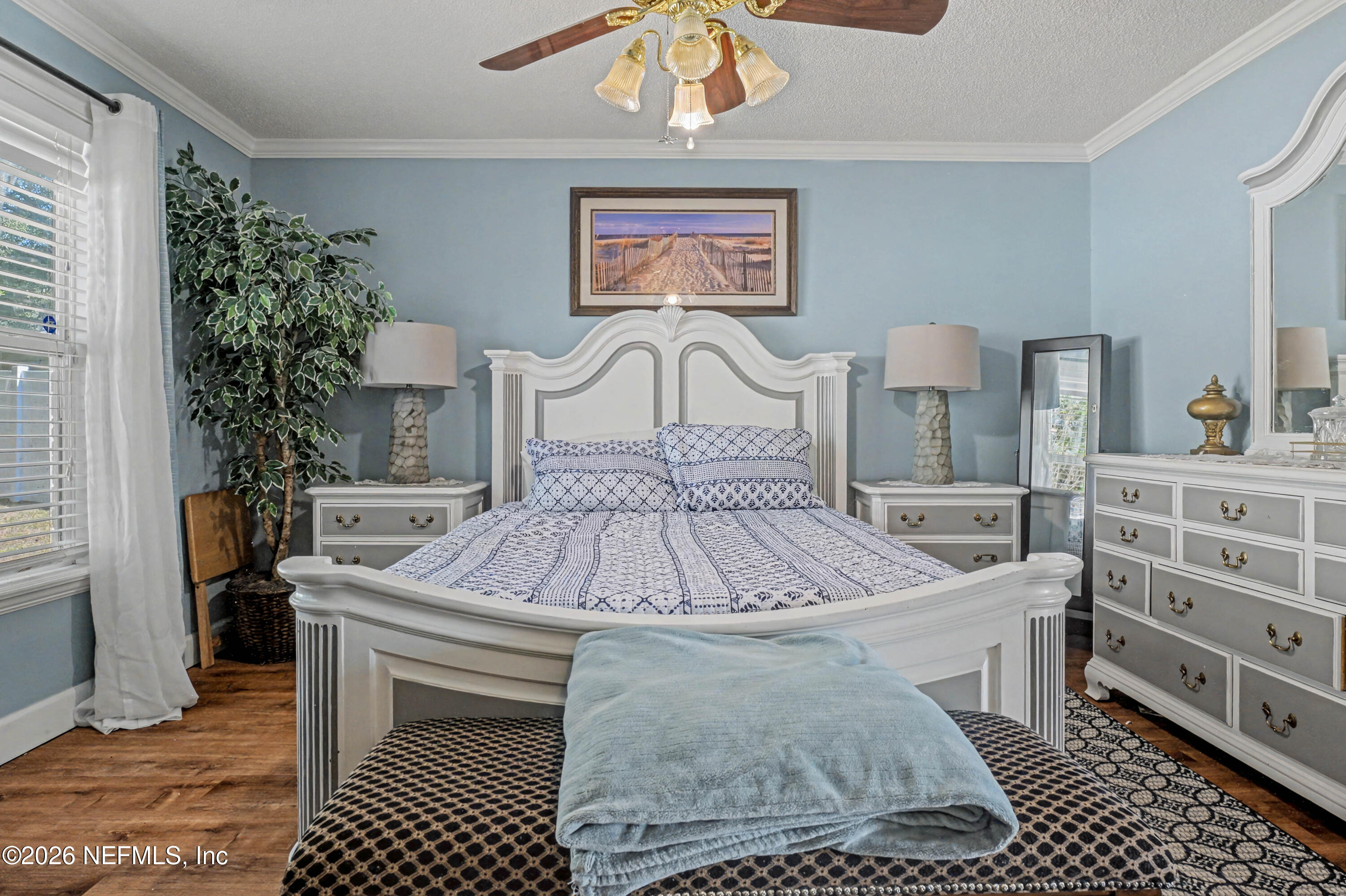 1502 Pointer Drive West Jacksonville, FL 32221 - Photo 23 of 33 a large bed sitting in a bedroom and table chair