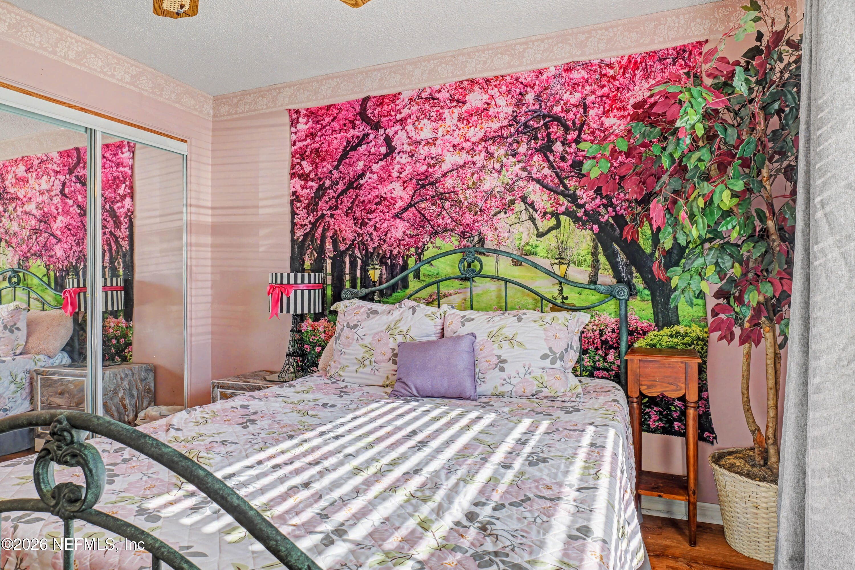 1502 Pointer Drive West Jacksonville, FL 32221 - Photo 26 of 33 a bedroom with a bed and a painting on the wall