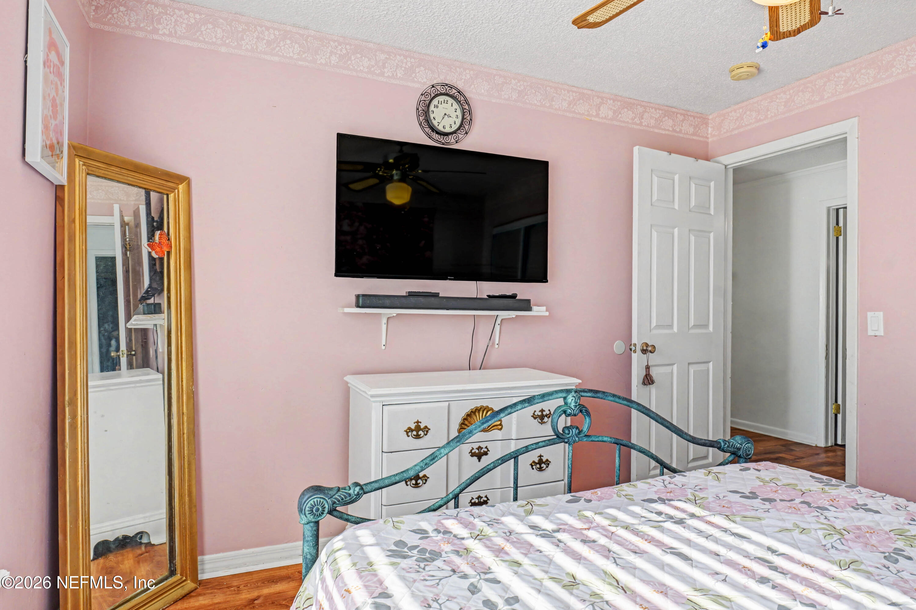 1502 Pointer Drive West Jacksonville, FL 32221 - Photo 27 of 33 a bedroom with a bed and a flat screen tv