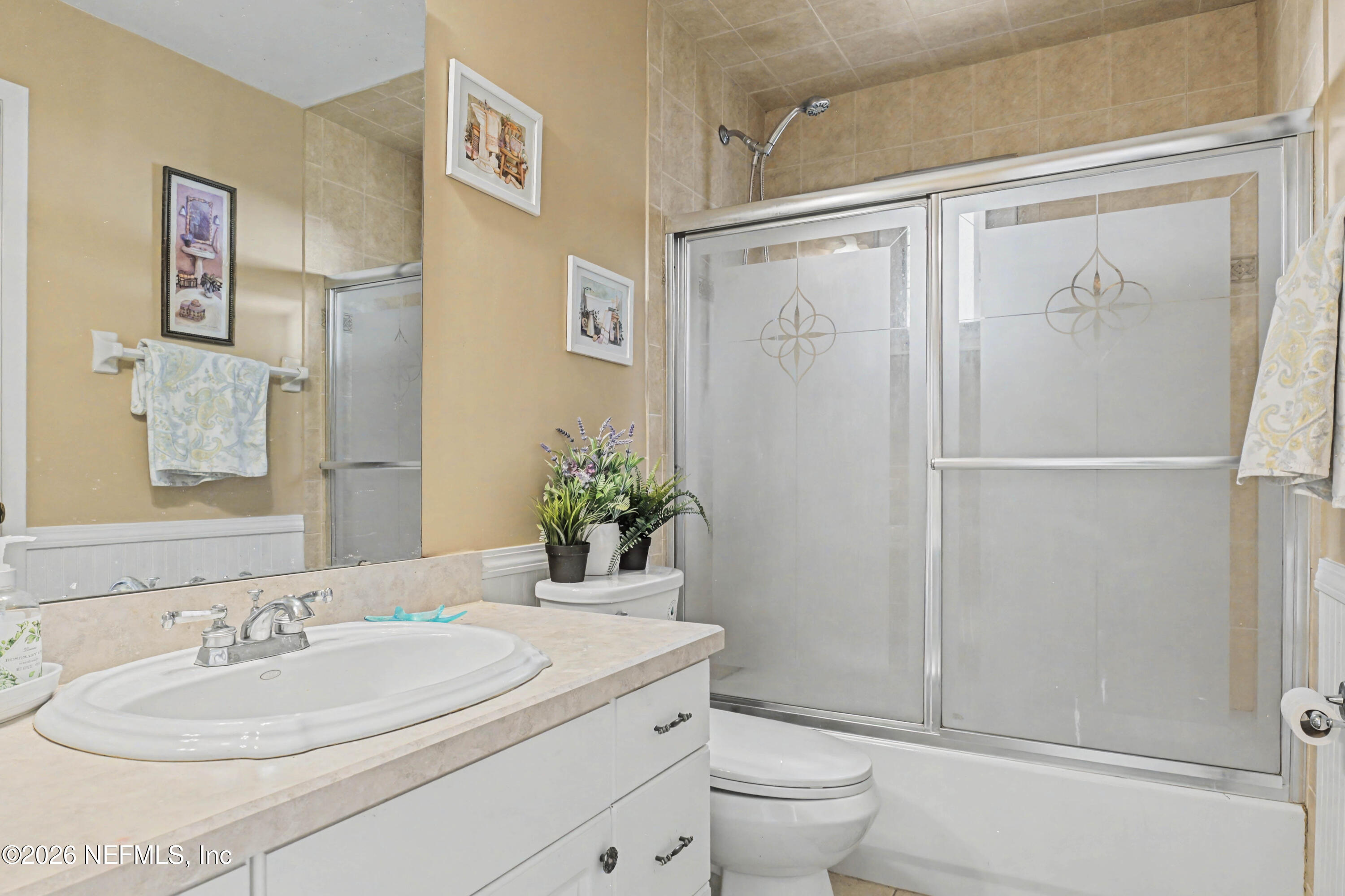 1502 Pointer Drive West Jacksonville, FL 32221 - Photo 28 of 33 a bathroom with a granite countertop sink toilet and shower