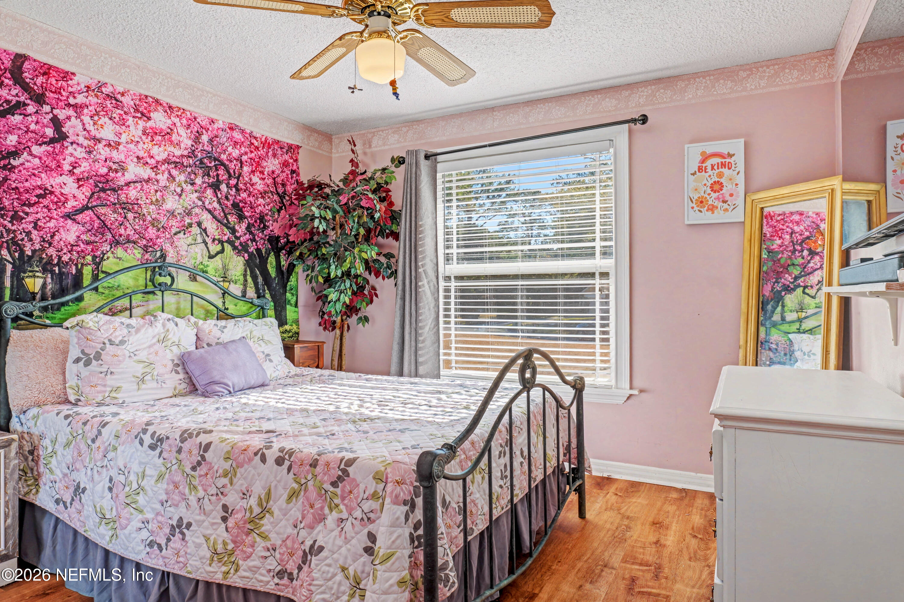 1502 Pointer Drive West Jacksonville, FL 32221 - Photo 29 of 33 a bedroom with a bed and a chandelier