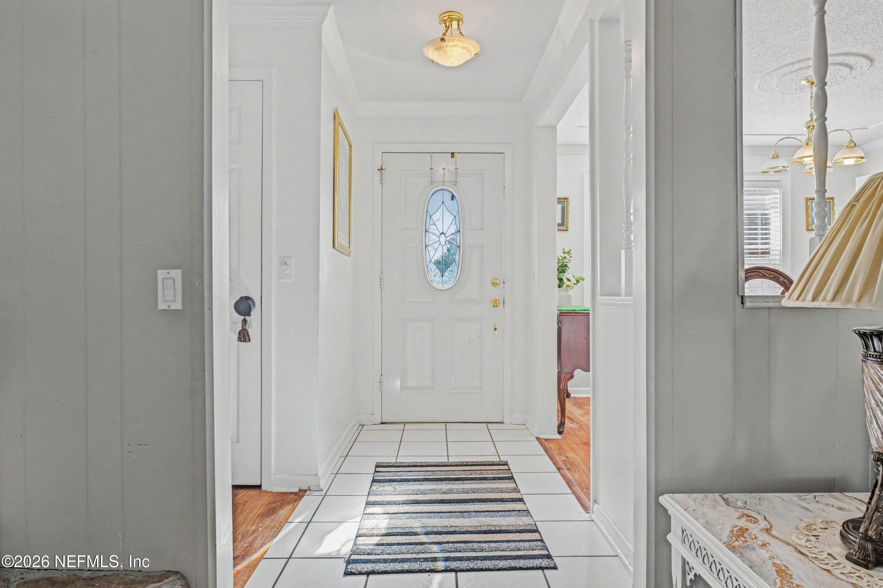 1502 Pointer Drive West Jacksonville, FL 32221 - Photo 32 of 33 a hallway with white cabinets and wooden floor