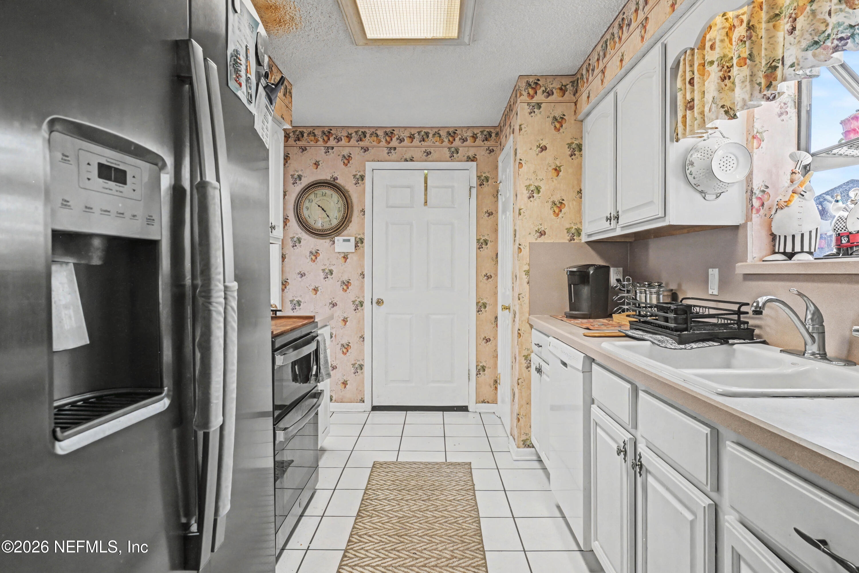 1502 Pointer Drive West Jacksonville, FL 32221 - Photo 7 of 33 a kitchen with stainless steel appliances granite countertop a refrigerator and a stove