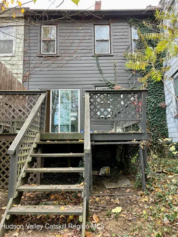 a balcony with wooden floor