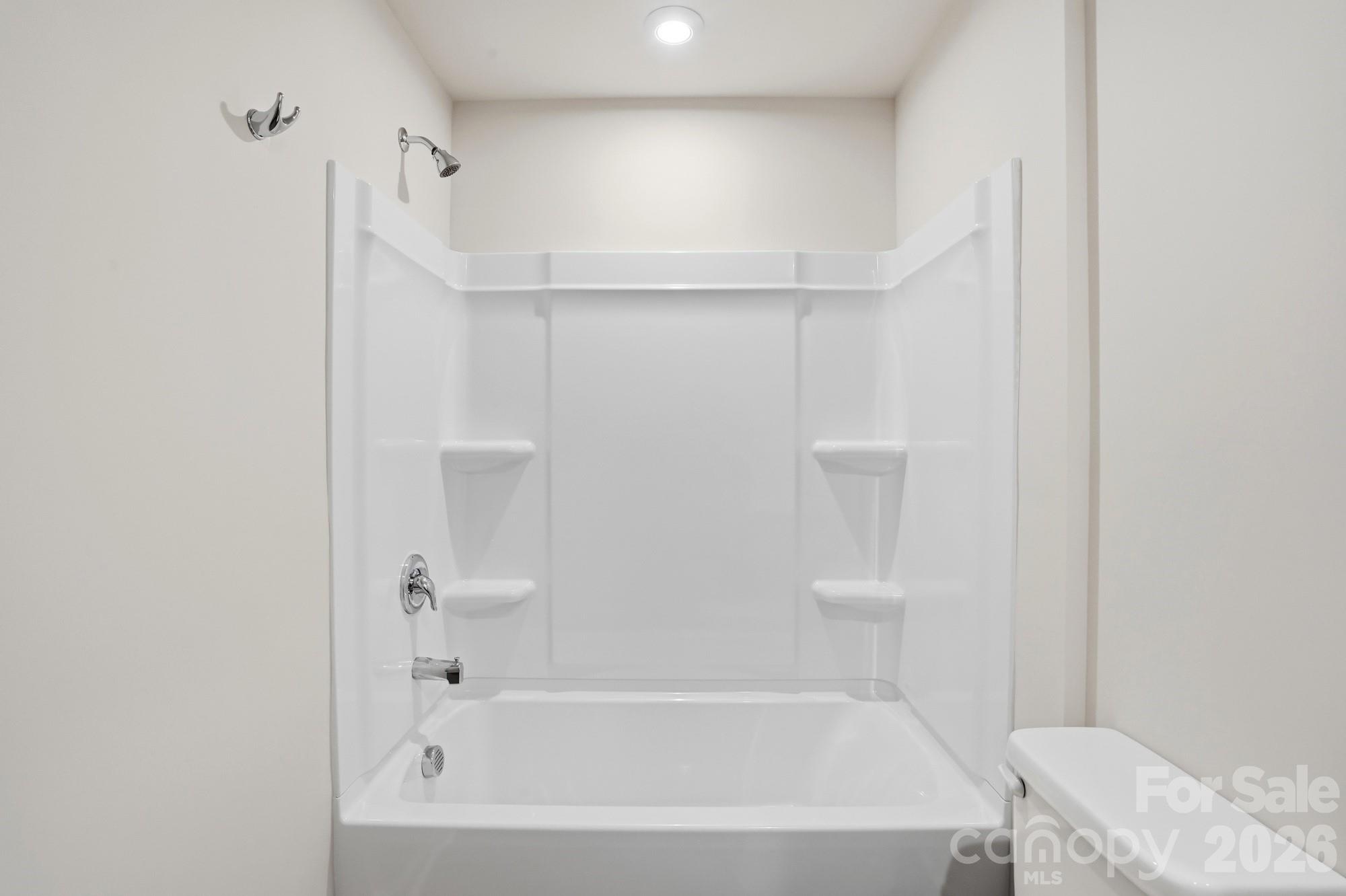 2540 Hedgecliff Road Kannapolis, NC 28083 - Photo 22 of 22 a white bath tub sitting next to a white toilet