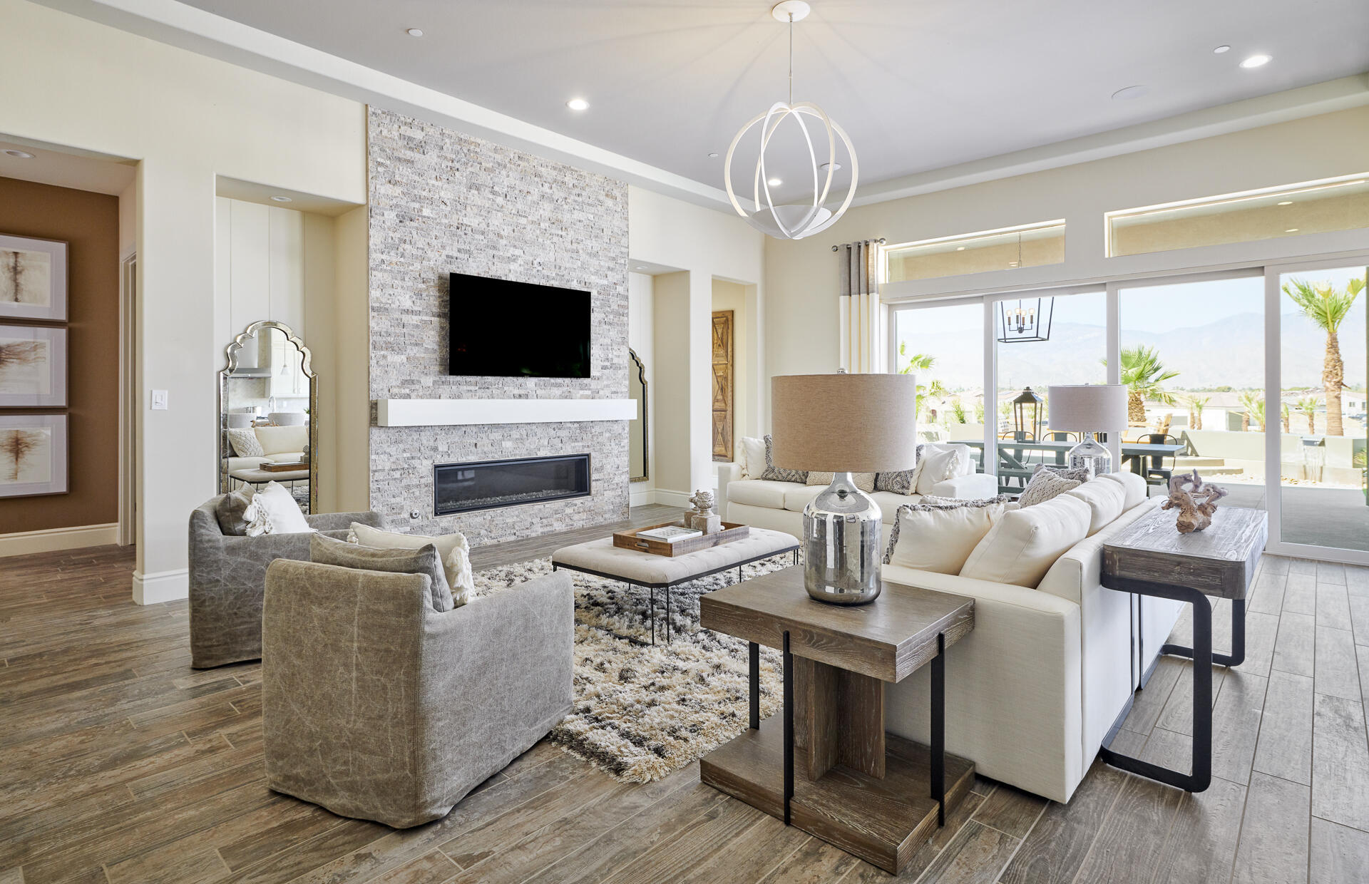 21 Chablis Rancho Mirage, CA 92270 - Photo 11 of 17 a living room with fireplace furniture and a flat screen tv