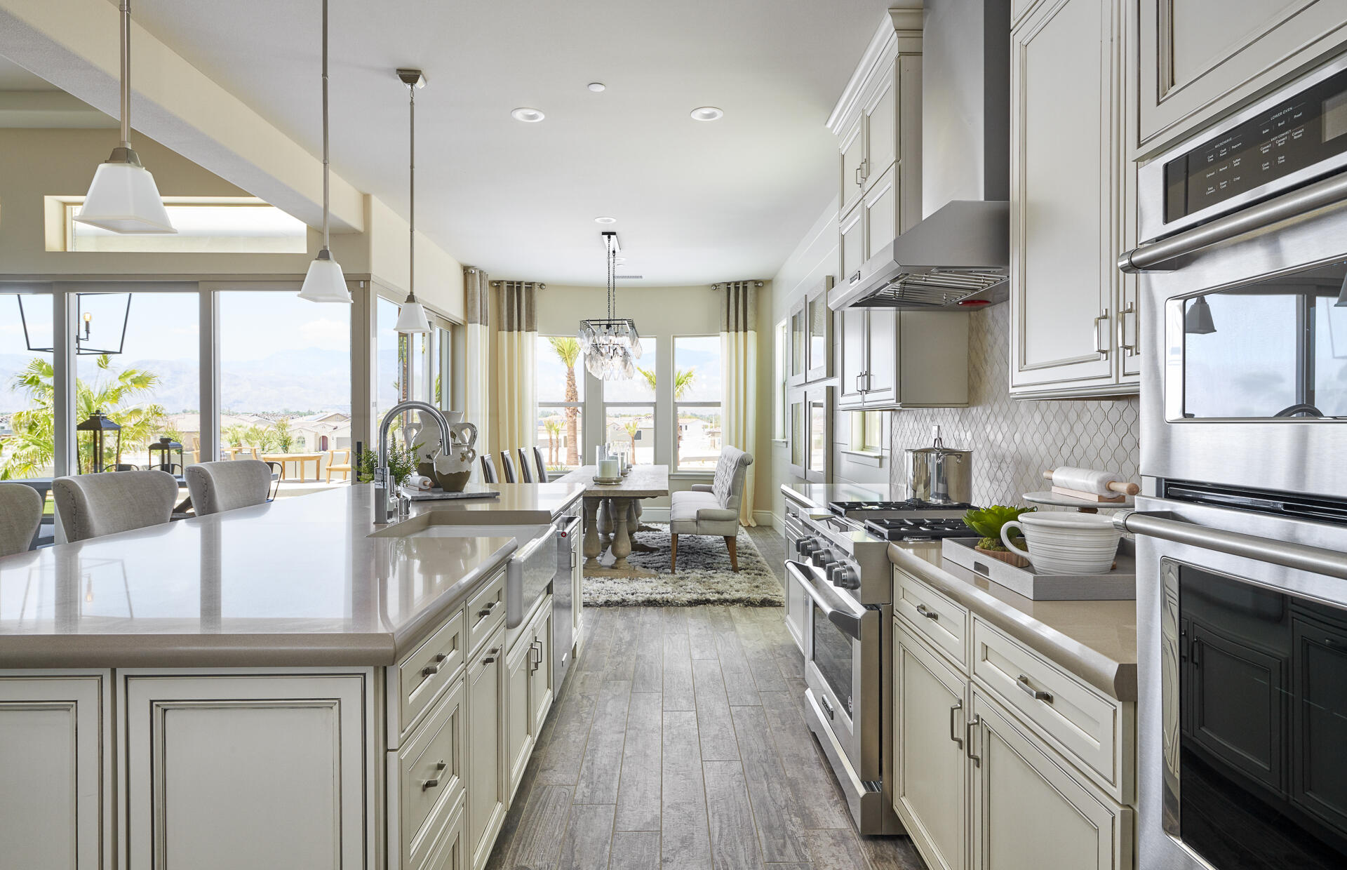 21 Chablis Rancho Mirage, CA 92270 - Photo 13 of 17 a kitchen with stainless steel appliances a stove a sink and cabinets