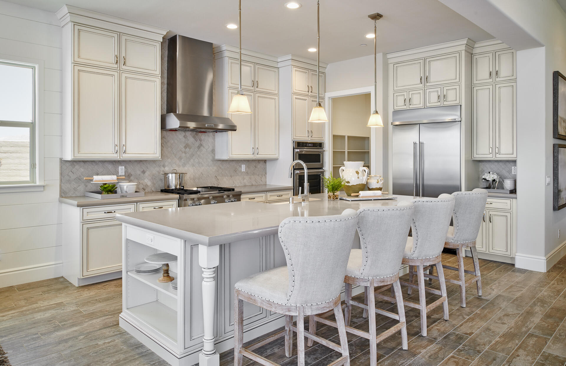 21 Chablis Rancho Mirage, CA 92270 - Photo 14 of 17 a kitchen with stainless steel appliances kitchen island granite countertop a table chairs sink and cabinets