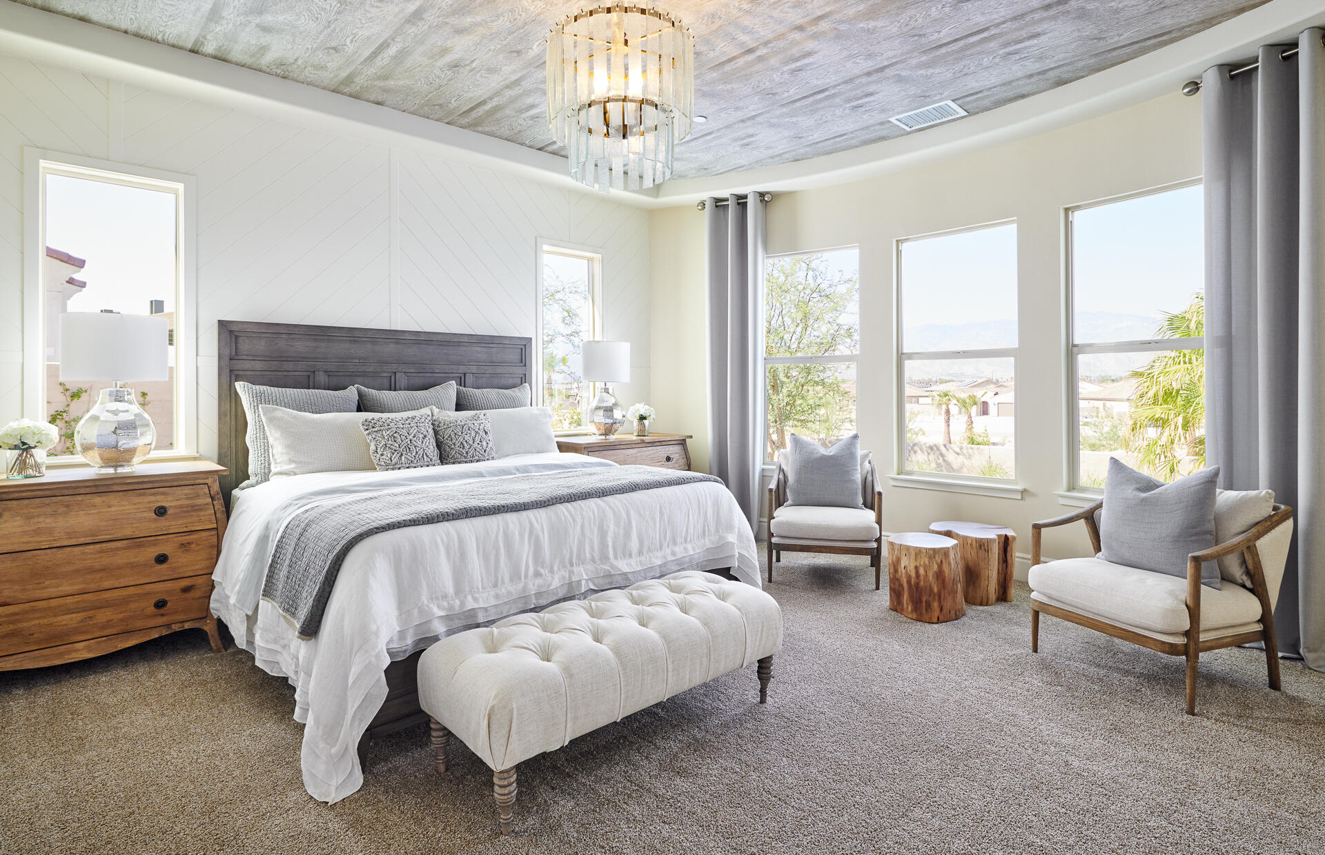 21 Chablis Rancho Mirage, CA 92270 - Photo 17 of 17 a spacious bedroom with a bed and a chandelier