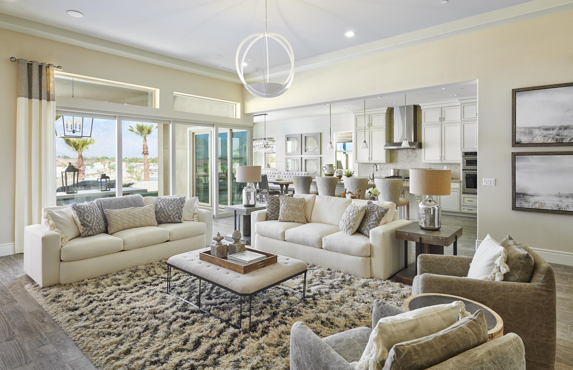 21 Chablis Rancho Mirage, CA 92270 - Photo 10 of 17 a living room with furniture dining table and a large window