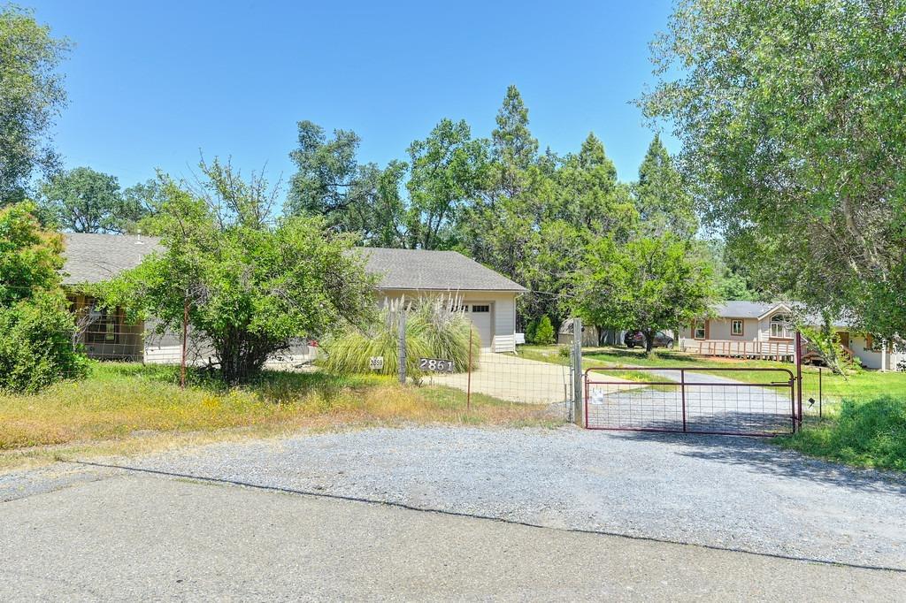2861 North Shingle Road Shingle Springs, CA 95682 - Photo 1 of 1 a view of swimming pool with garden and trees