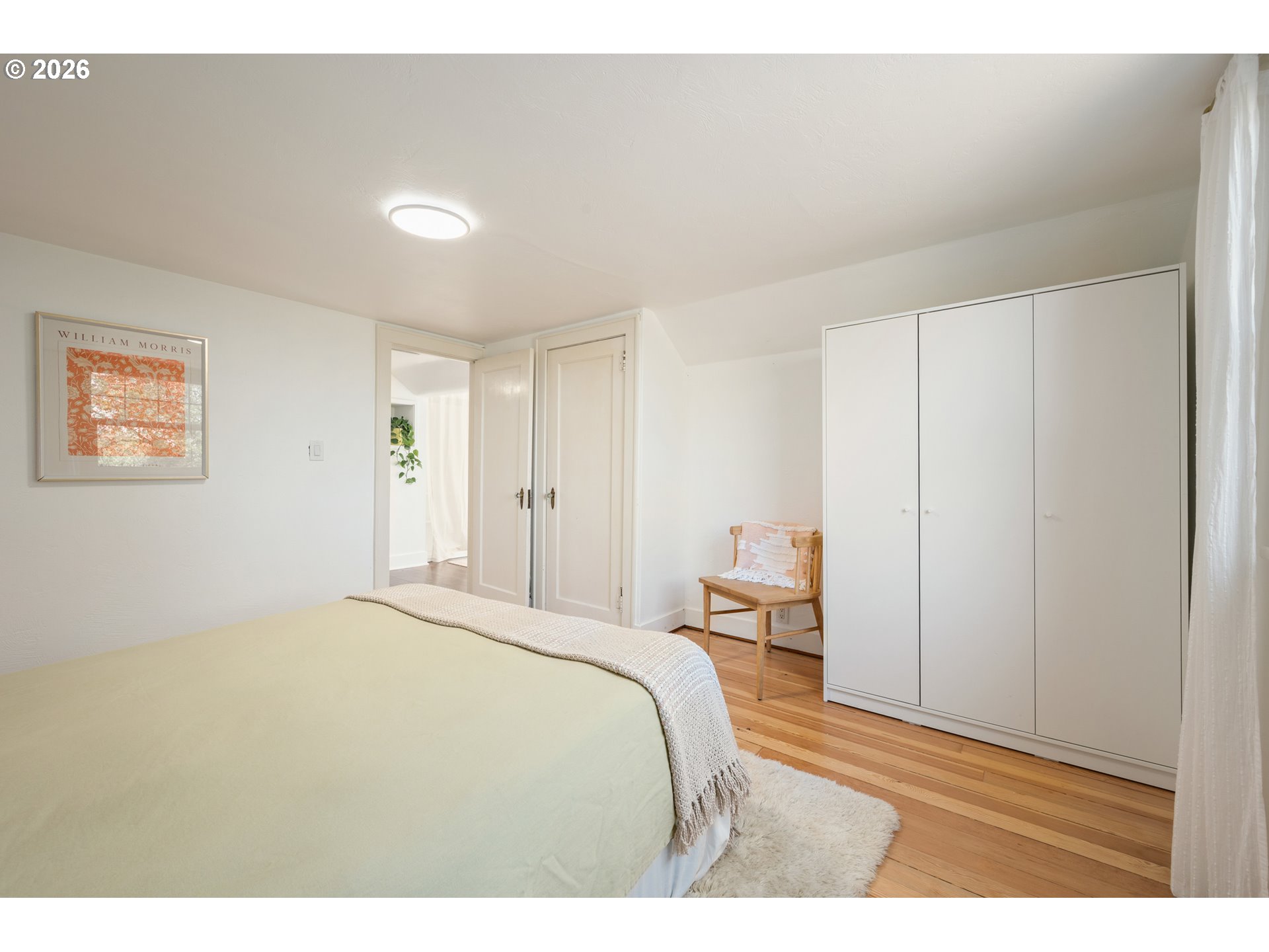 2219 City View Street Eugene, OR 97405 - Photo 22 of 48 a bedroom with a bed and a table