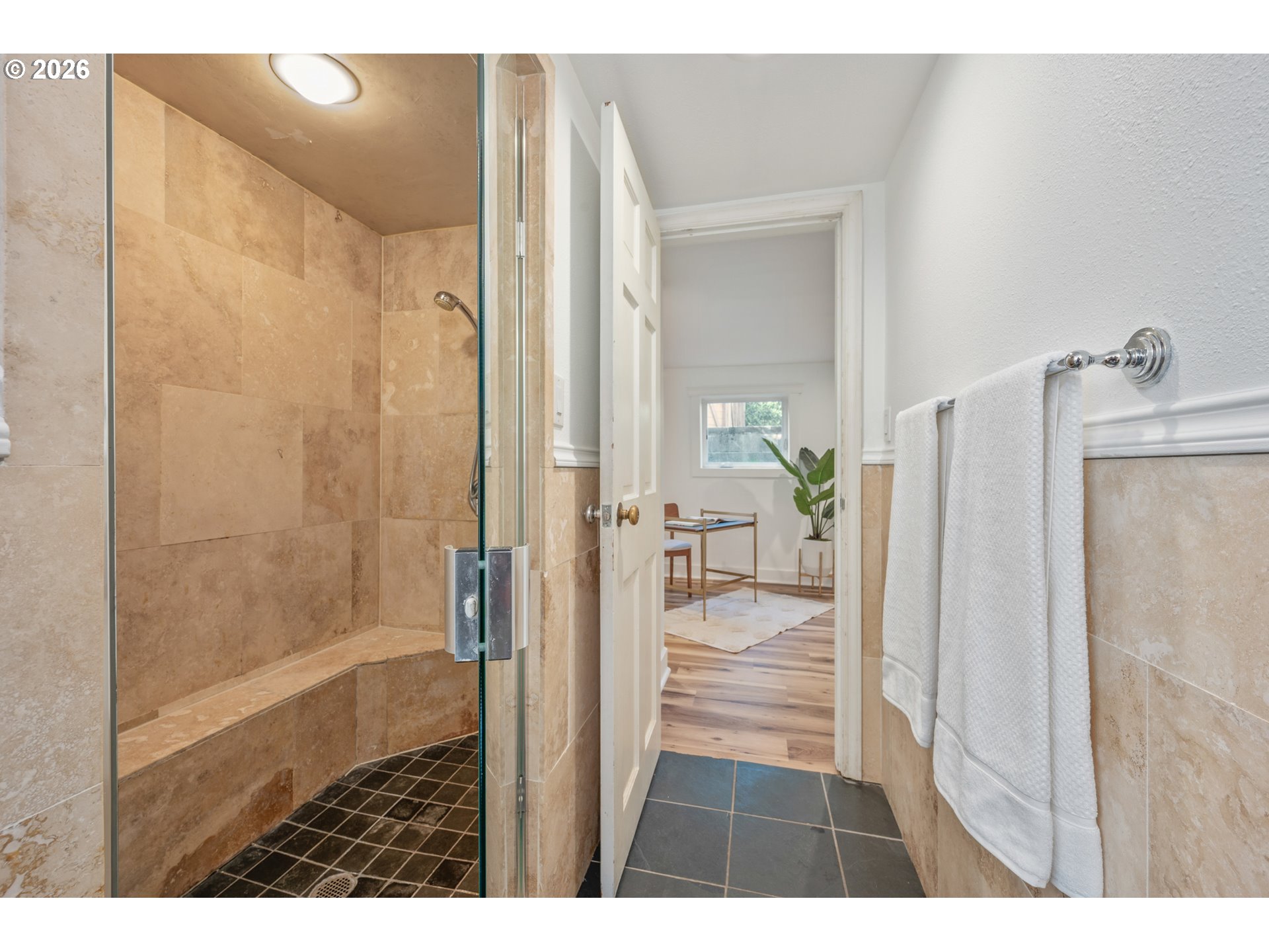 2219 City View Street Eugene, OR 97405 - Photo 32 of 48 a bathroom with a glass shower door