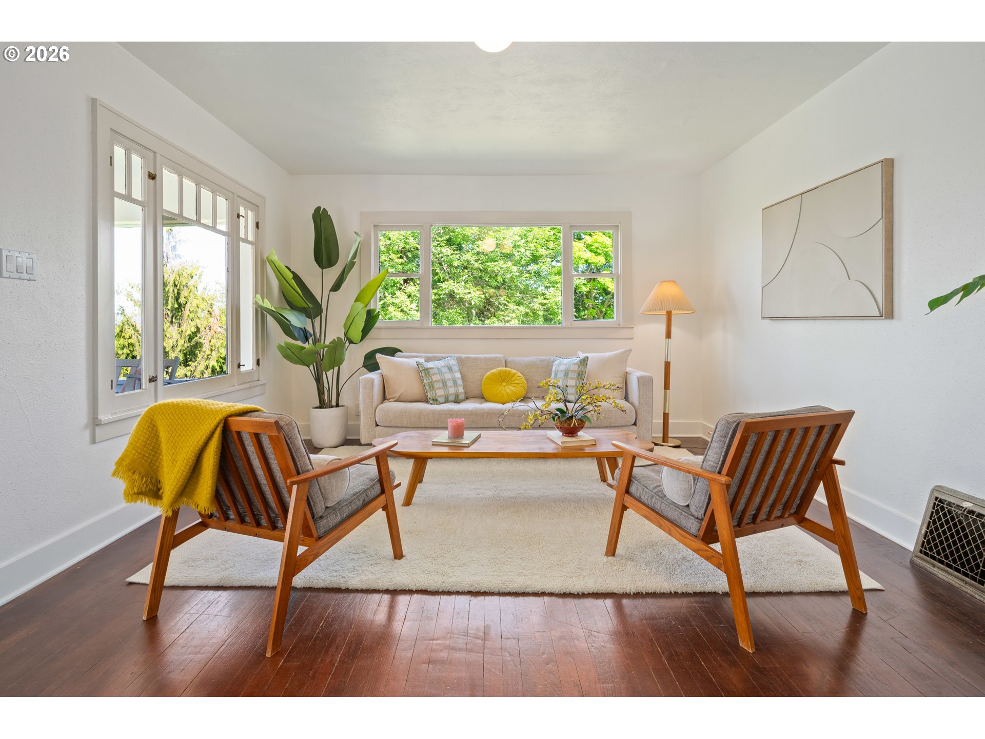 2219 City View Street Eugene, OR 97405 - Photo 5 of 48 a living room with a couch and a potted plant
