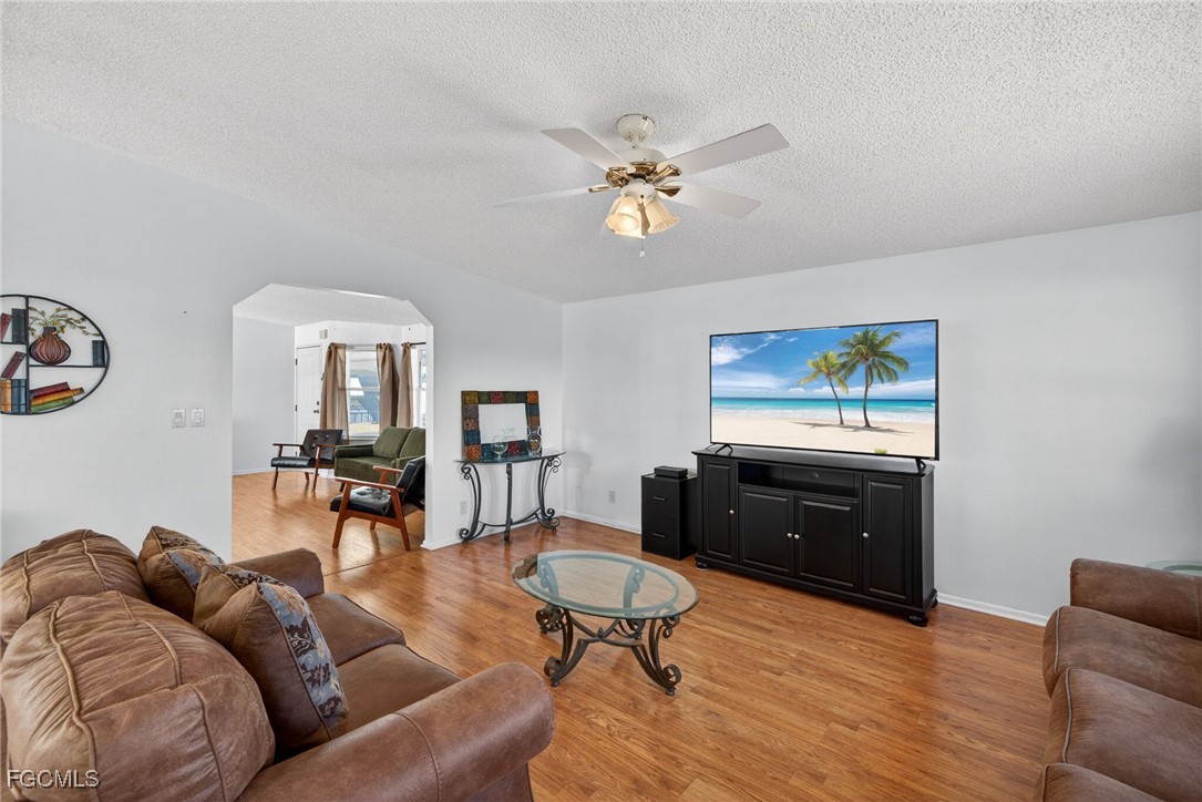 3088 Skipper Lane St. James City, FL 33956 - Photo 19 of 43 a living room with furniture and a wooden floor