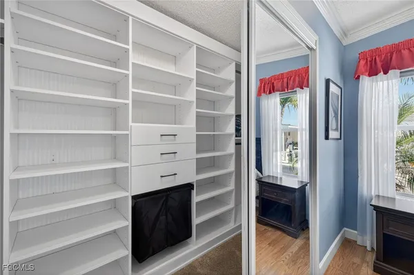 a bedroom with bed and window