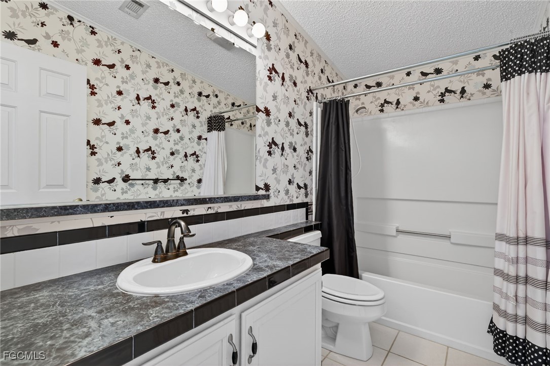 3088 Skipper Lane St. James City, FL 33956 - Photo 30 of 43 a bathroom with a sink toilet and shower