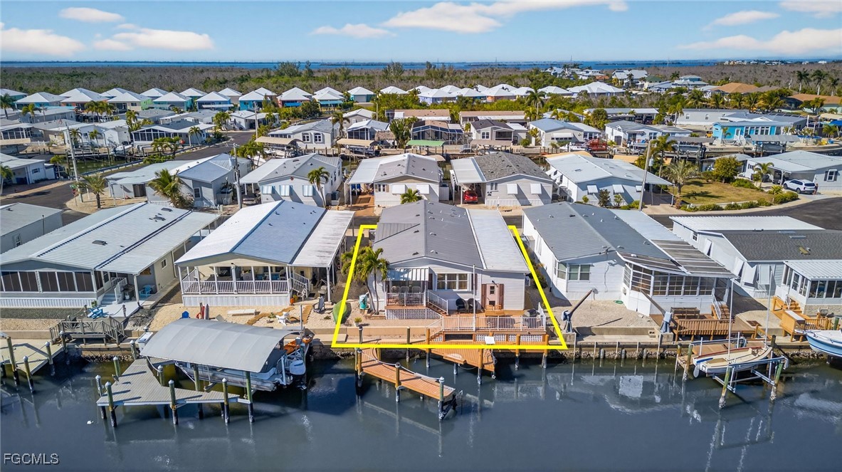 3088 Skipper Lane St. James City, FL 33956 - Photo 3 of 43 an aerial view of a city with lawn chairs
