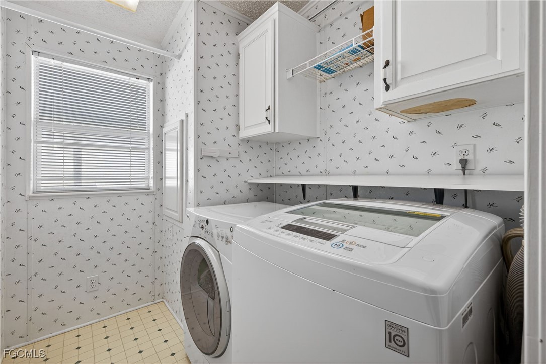3088 Skipper Lane St. James City, FL 33956 - Photo 31 of 43 a utility room with dryer and washer