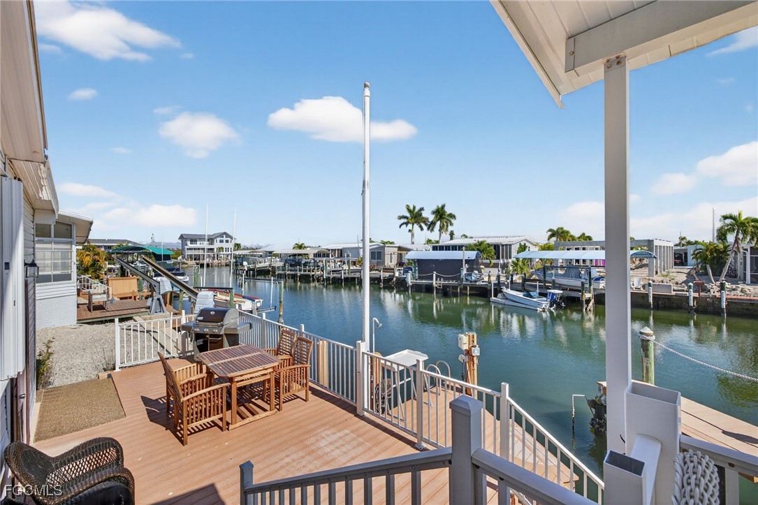 3088 Skipper Lane St. James City, FL 33956 - Photo 32 of 43 a view of a lake from a balcony
