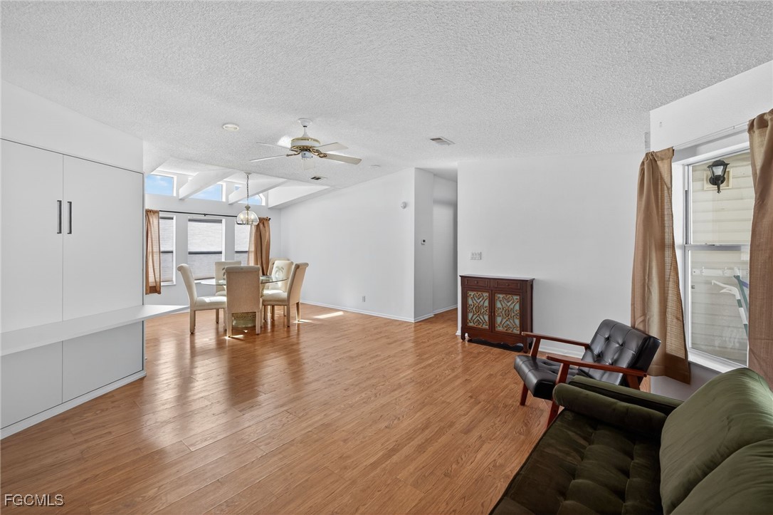 3088 Skipper Lane St. James City, FL 33956 - Photo 7 of 43 a living room with furniture and wooden floor