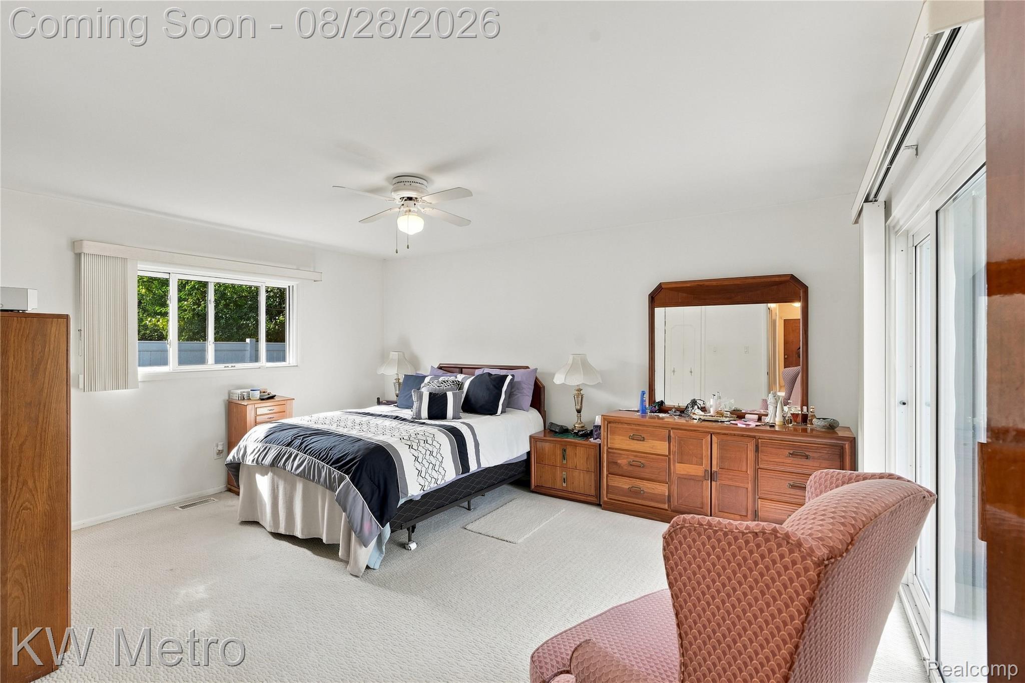 17700 Adrian Road Southfield, MI 48075 - Photo 13 of 24 Carpeted interior with a window, ceiling fan, and glass sliding door