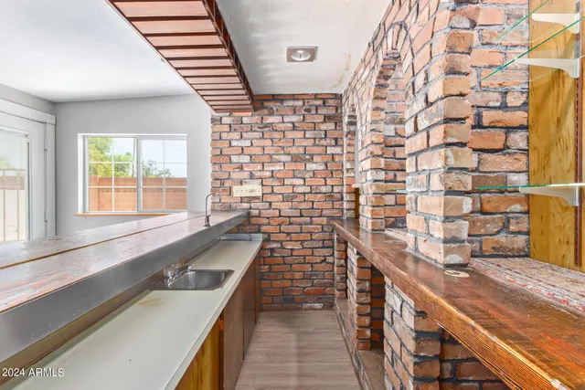 a view of a living room and hallway with wooden floor