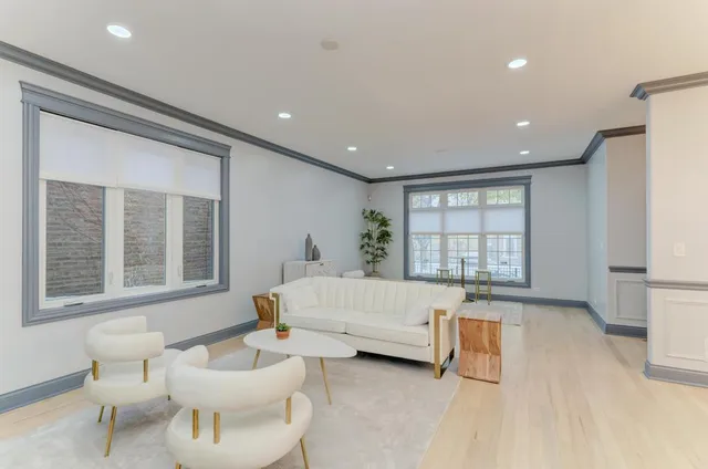 a kitchen with stainless steel appliances kitchen island granite countertop a refrigerator and a stove top oven