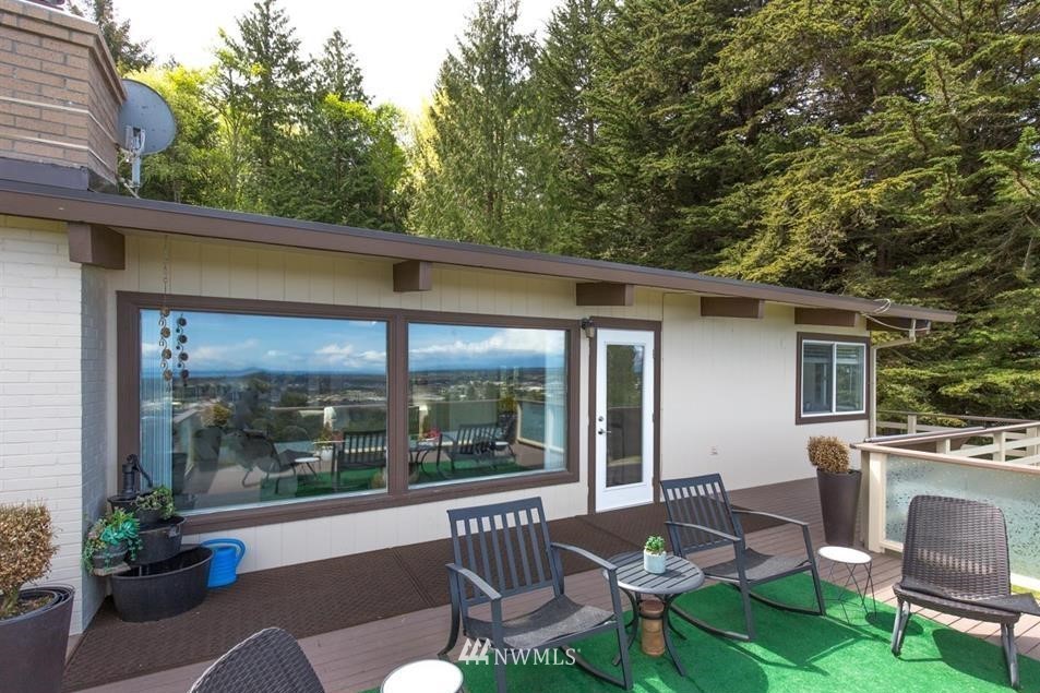 744 Miller Road Sequim, WA 98382 - Photo 15 of 40 a patio with yard glass top table and chairs