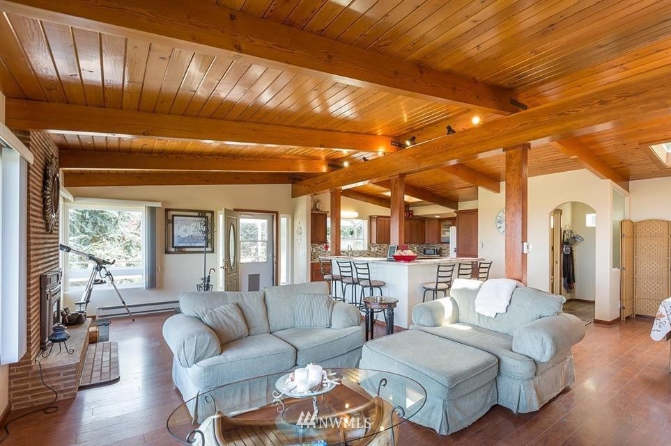 744 Miller Road Sequim, WA 98382 - Photo 17 of 40 a living room with furniture and a large window
