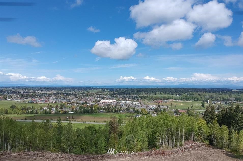 744 Miller Road Sequim, WA 98382 - Photo 2 of 40 a view of a lake from a yard