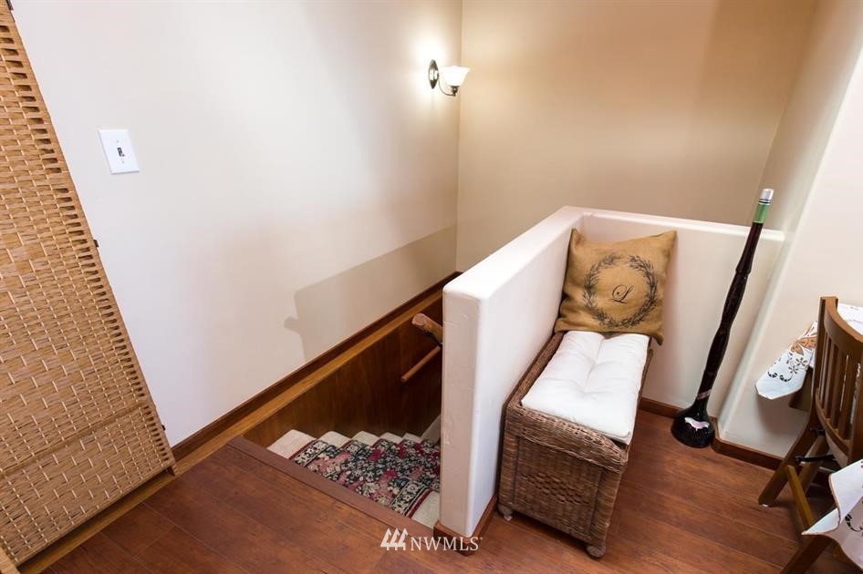 744 Miller Road Sequim, WA 98382 - Photo 27 of 40 a view of a hallway with wooden floor and staircase
