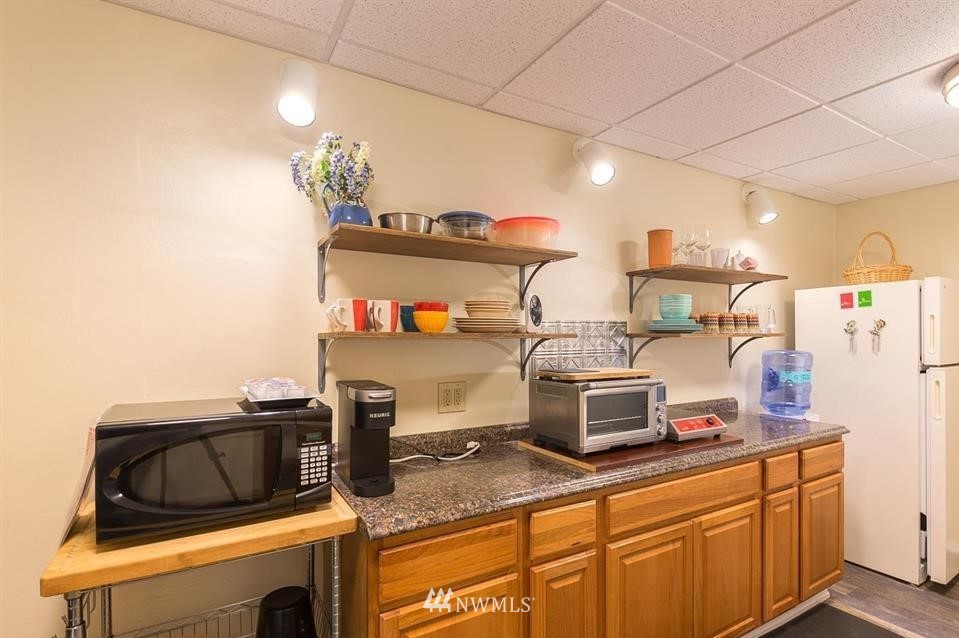 744 Miller Road Sequim, WA 98382 - Photo 31 of 40 a kitchen with stainless steel appliances granite countertop a sink and a stove