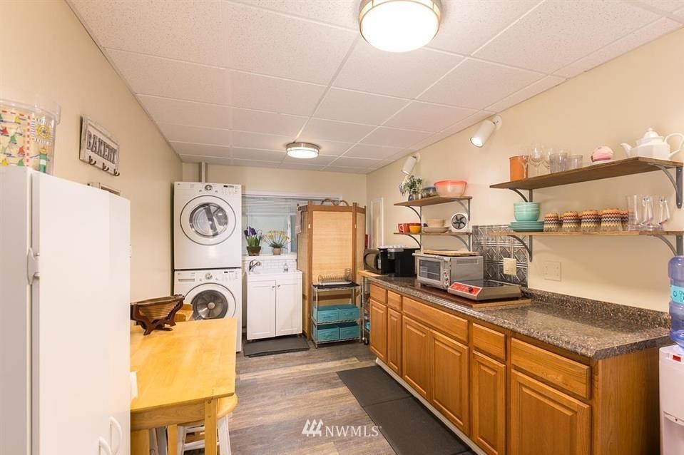 744 Miller Road Sequim, WA 98382 - Photo 32 of 40 a kitchen with stainless steel appliances granite countertop a sink and cabinets