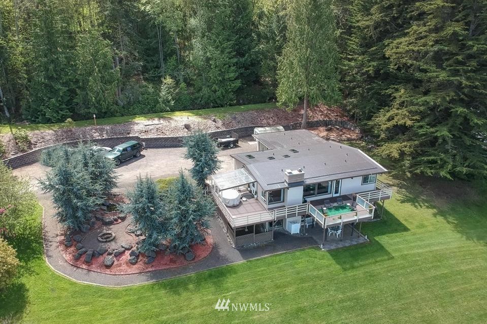 744 Miller Road Sequim, WA 98382 - Photo 4 of 40 an aerial view of a house with swimming pool and a yard