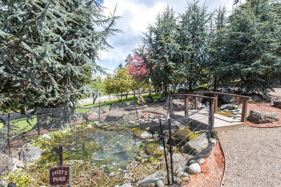 744 Miller Road Sequim, WA 98382 - Photo 7 of 40 a backyard of a house with table and chairs