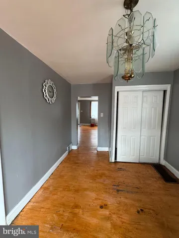 a view of a hallway with a chandelier