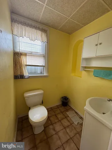 a bathroom with a toilet and a sink