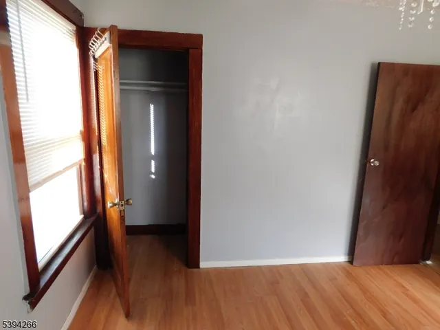 a white toilet sitting next to a bath tub