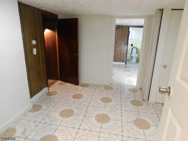 a bathroom with a toilet a sink and a mirror