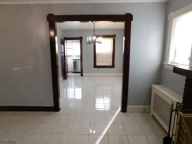a hallway with windows and a table in it