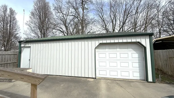 a view of wooden door and outdoor space