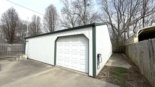 a view of a house with a snow in the yard