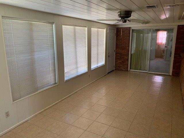 1502 Ave K Ralls, TX 79357 - Photo 11 of 23 an empty room with entrance and windows