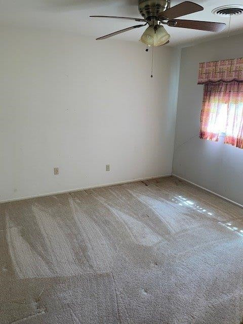 1502 Ave K Ralls, TX 79357 - Photo 17 of 23 an empty room with a ceiling fan and window