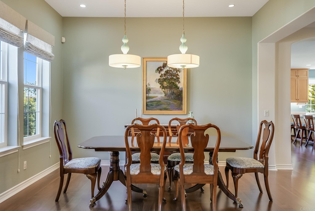 8046 Calle Pinon Carlsbad, CA 92009 - Photo 12 of 51 a view of a dining room with furniture and chandelier