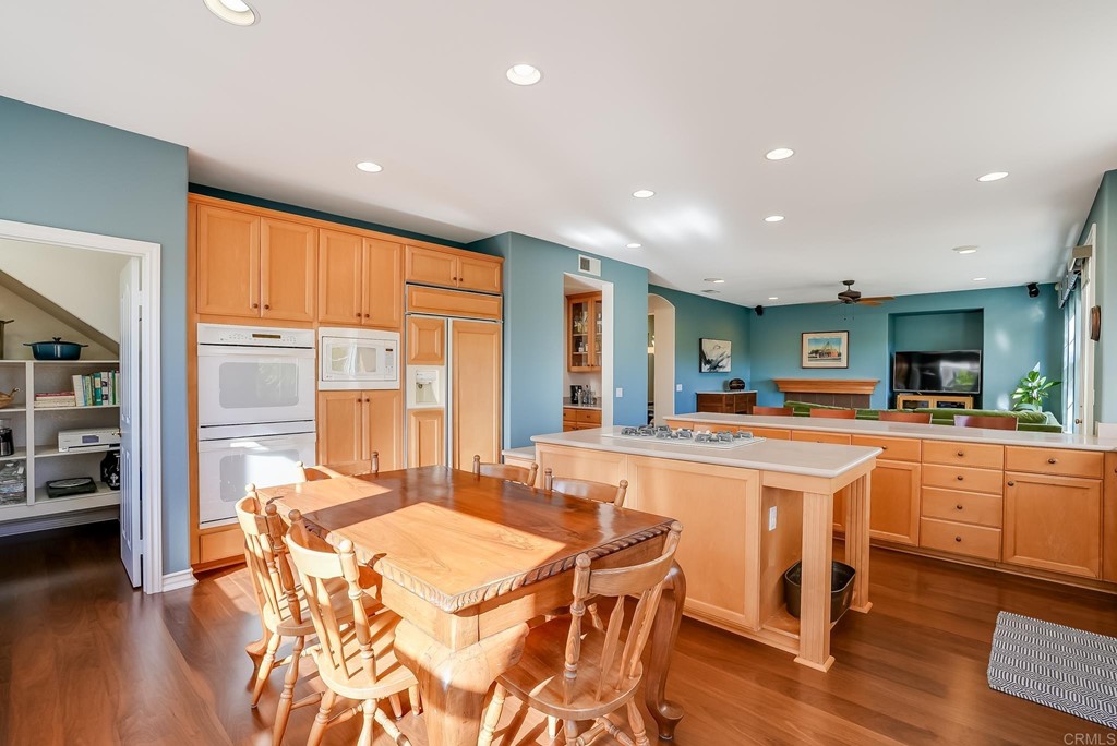 8046 Calle Pinon Carlsbad, CA 92009 - Photo 18 of 51 a large kitchen with kitchen island a large island in it