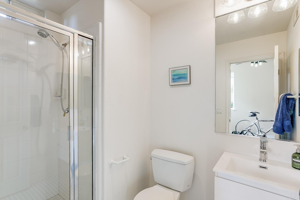 8046 Calle Pinon Carlsbad, CA 92009 - Photo 22 of 51 a bathroom with a toilet sink and shower
