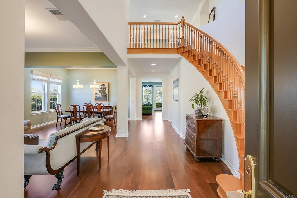 8046 Calle Pinon Carlsbad, CA 92009 - Photo 23 of 51 a view of a livingroom with furniture wooden floor and windows